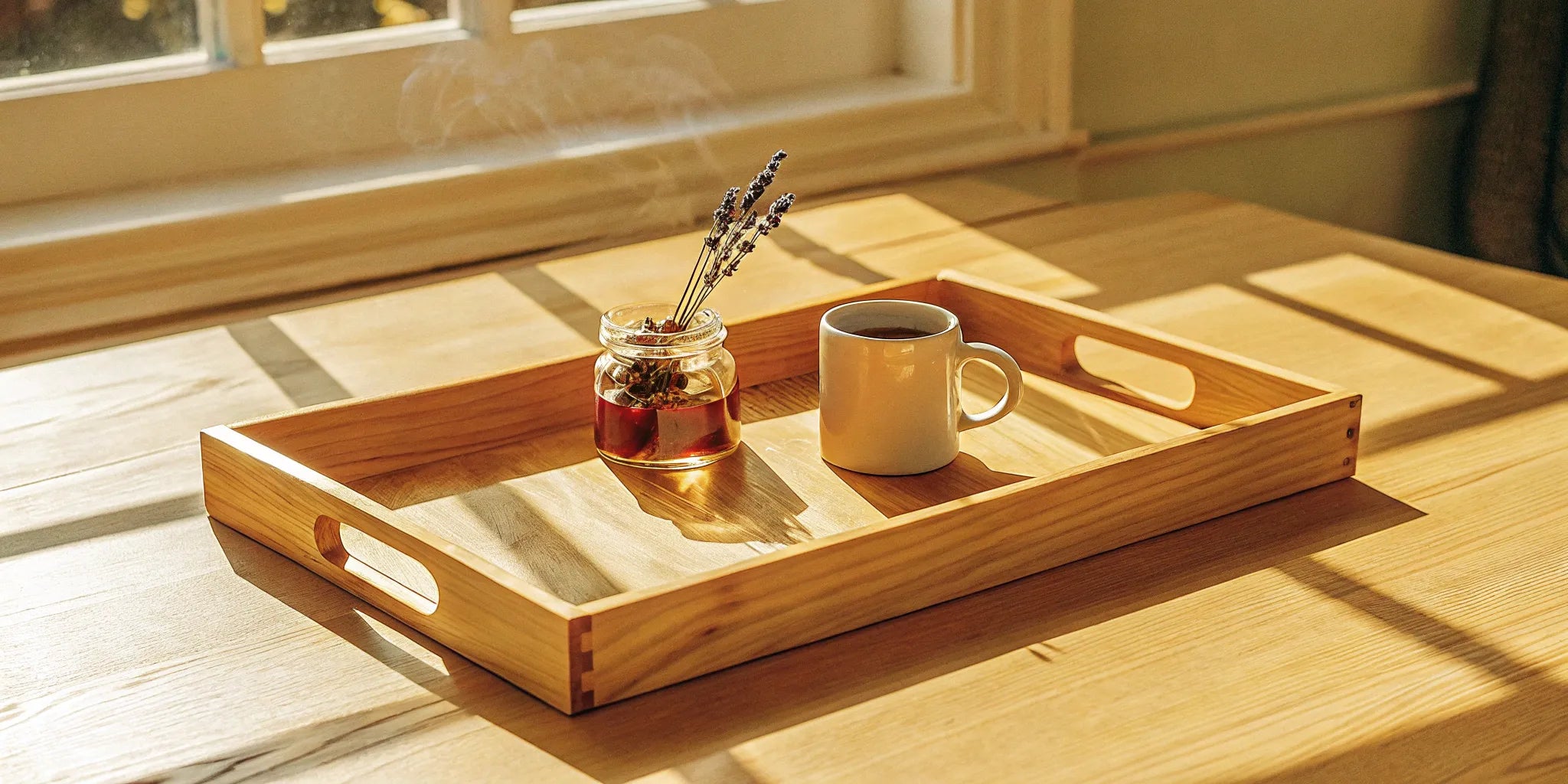 A jar of the best CBD gummies for pain relief on a wooden tray in the sun.