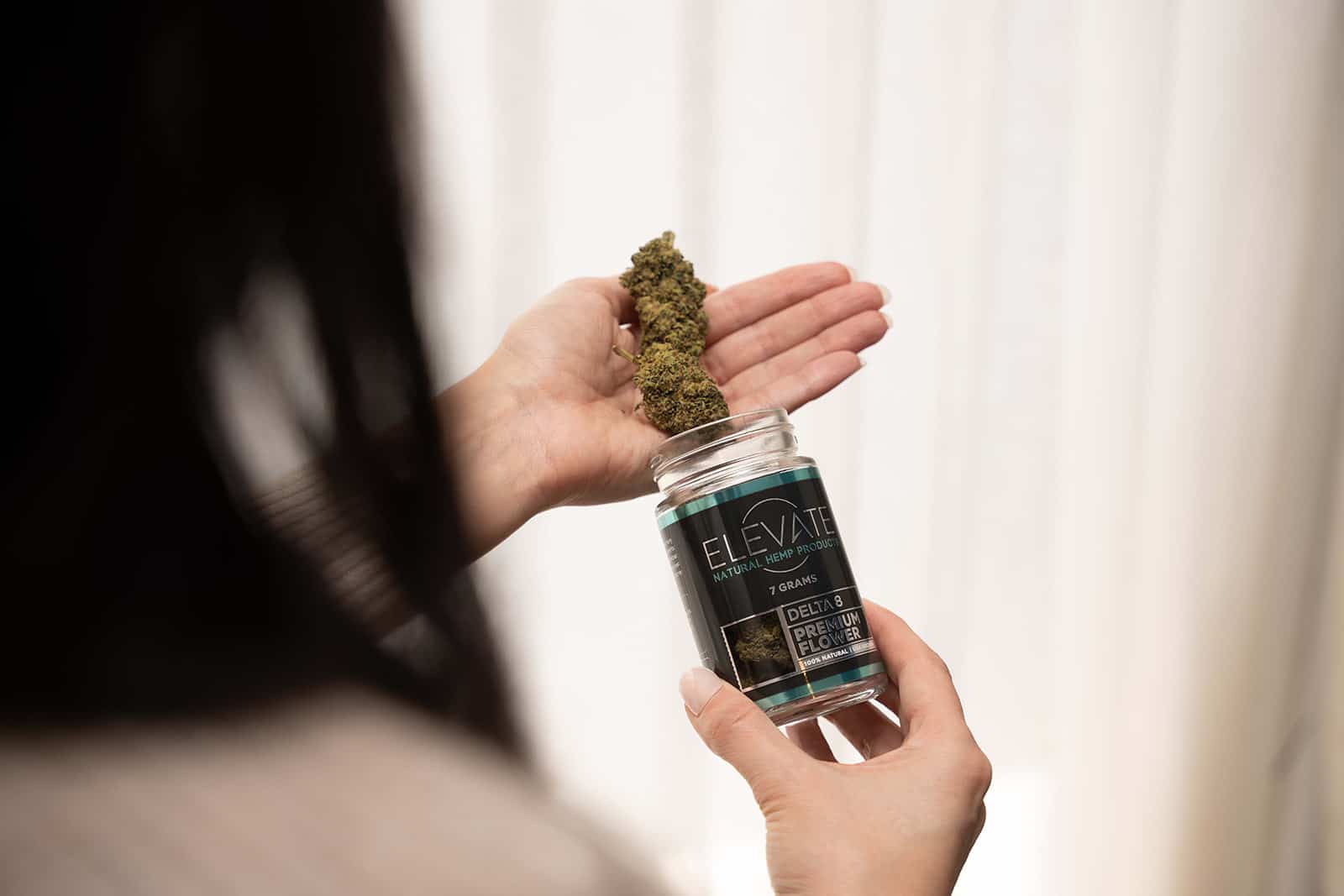 Women Holding Delta 8 THC Flower