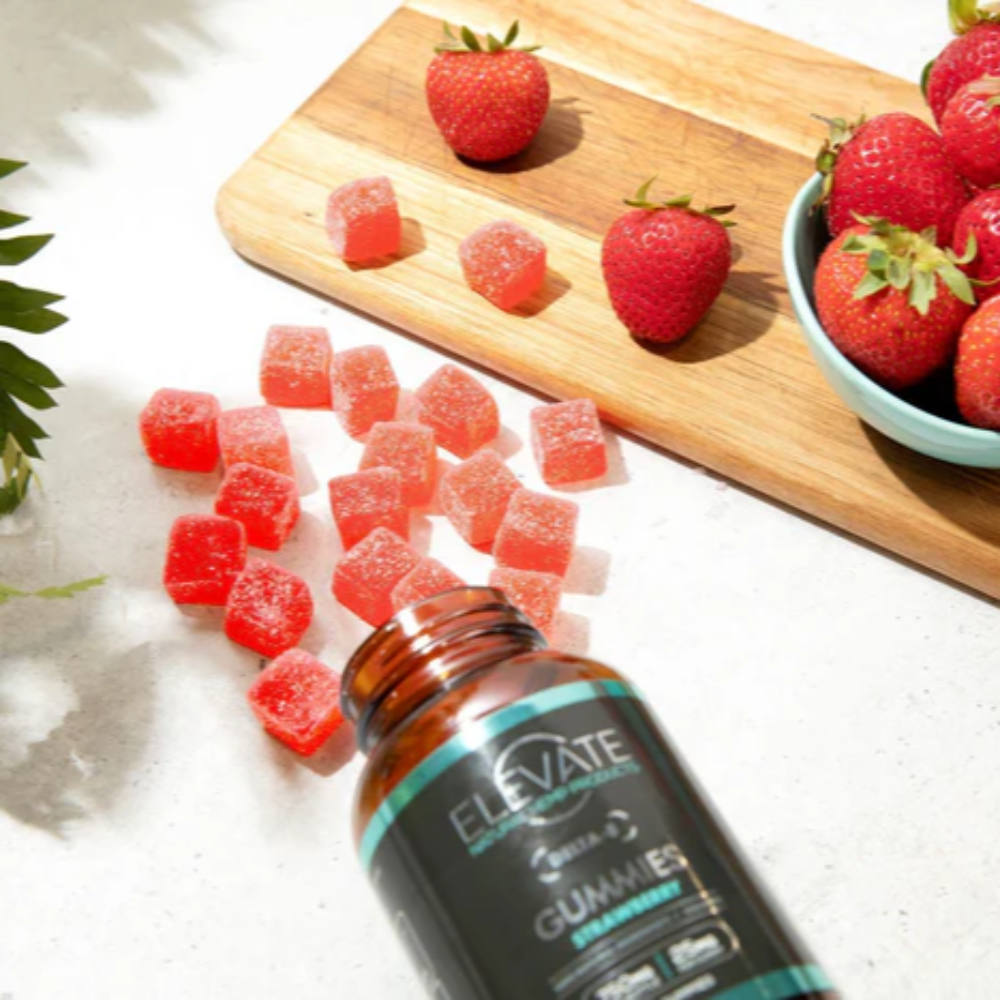 Bottle of 'Elevate' gummies with strawberries and gummy bears on a wooden board.