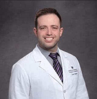 Dr. David Smith, medical professional in a white coat with a purple tie