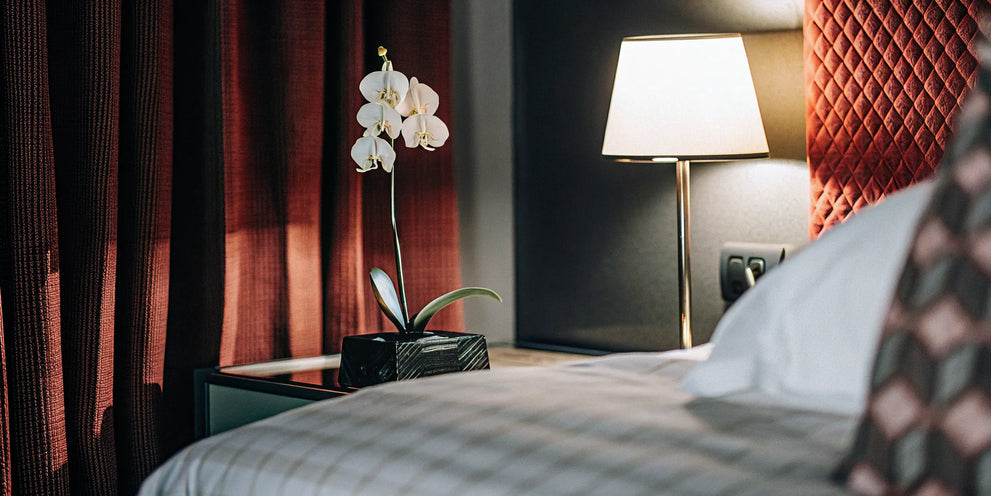 Woman relaxing in bed with THC products for arousal.